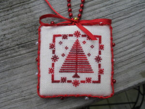Finished Christmas cross stitch ornament.