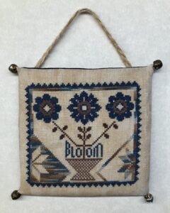 finished bloom flowers Quaker cross stitch hanging